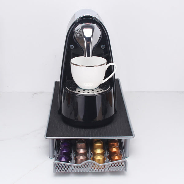 Close-up of iron pull-out drawer mechanism — smooth operation on desktop stand
