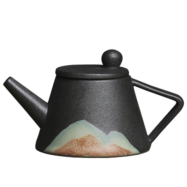 Wudy Kitchen Wudy Japanese Ceramic Teapot — underglaze ceramic, precision pour spout — close-up detail on walnut surface
