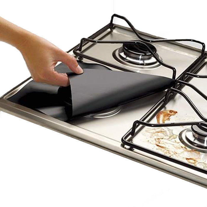 Black liner placed around a burner under the pan support