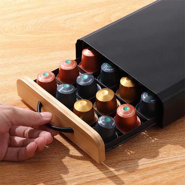 Metal coffee capsule stand closed — powder-coated steel finish on kitchen surface