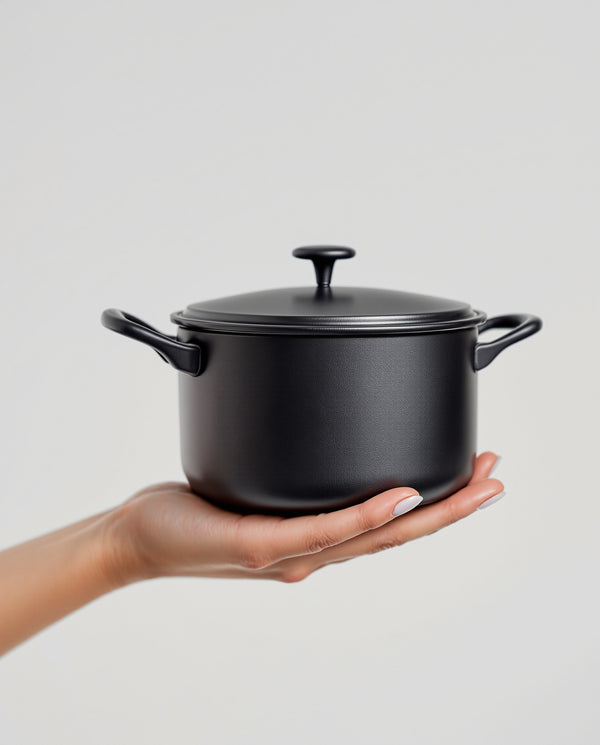 Cast Iron Uncoated Mini Milk Pot Baby Food Pot — in_hand shot | Wudy Kitchen